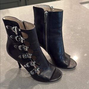 Michael Kors Black Heeled Boots with Edgy Buckle Design